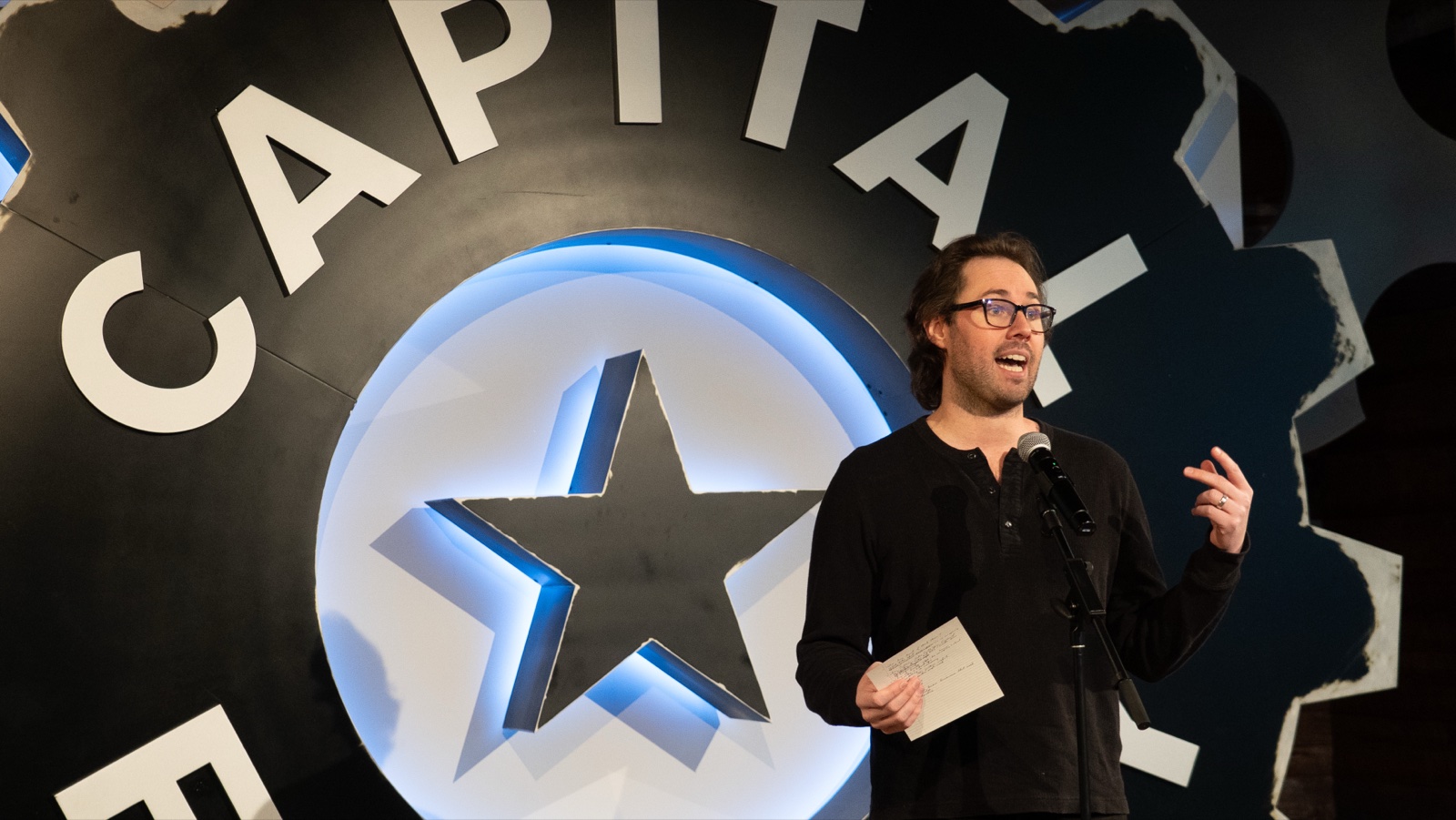 Collier Hammons, founder of Super Bad Ads, speaking on stage at Capital Factory in Austin